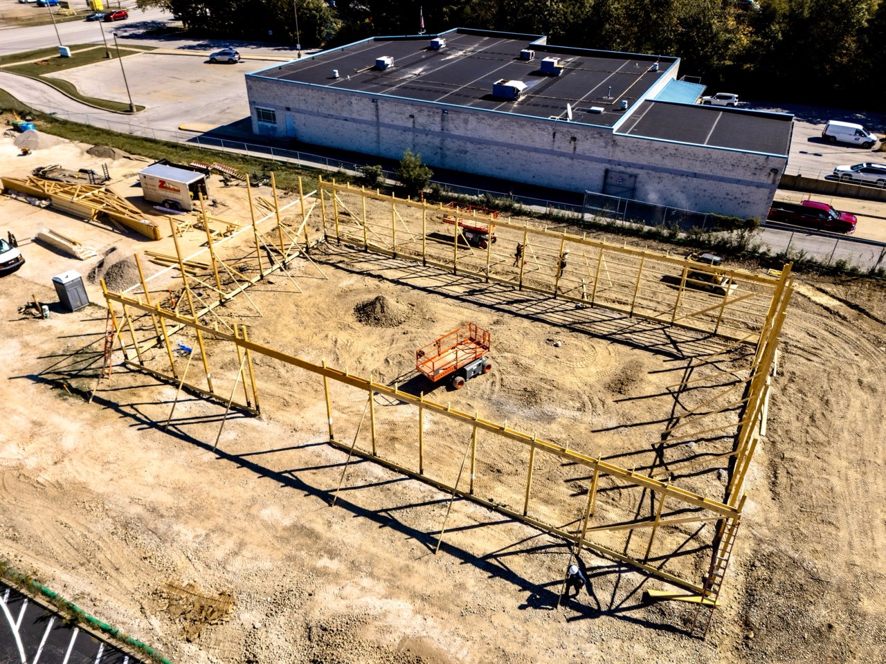 Aerial view of wall framing going up at the Apex Strength Club site on Liberty Avenue in Vermilion, Ohio
