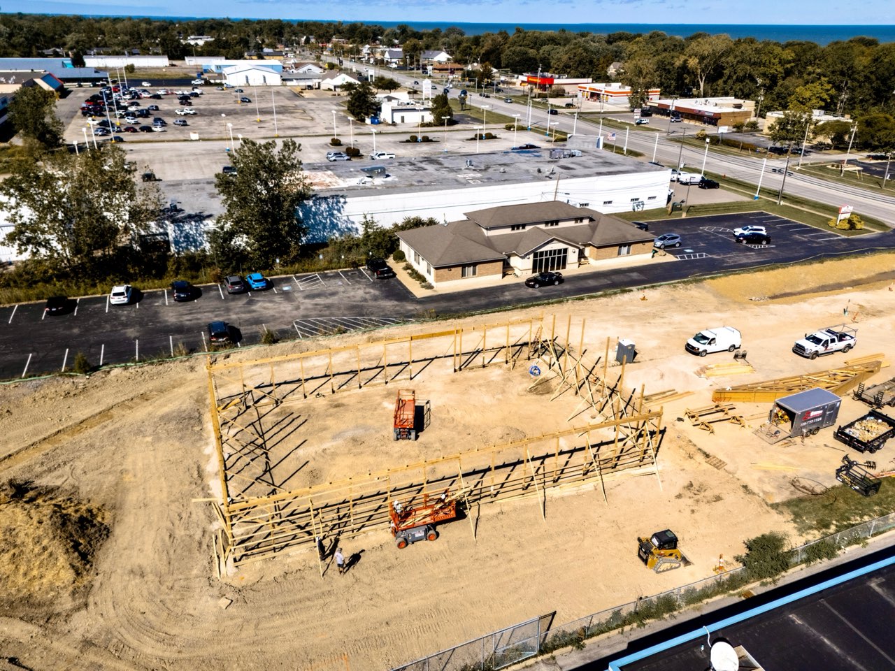 Aerial view of the framed Apex Strength Club building with downtown Vermilion and Lake Erie beyond it